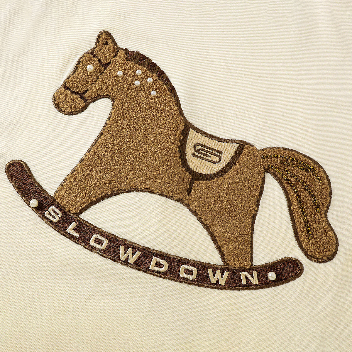 SLOWDOWN Gentle Pony Long Sleeved Tee Cream (SS26)